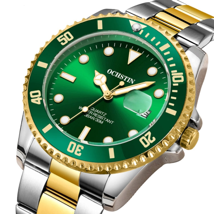 Close-up two-tone stainless steel quartz watch with green dial, gold bezel, date window.
