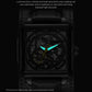 Black skeleton mechanical watch with glowing green-blue hands and dark dial