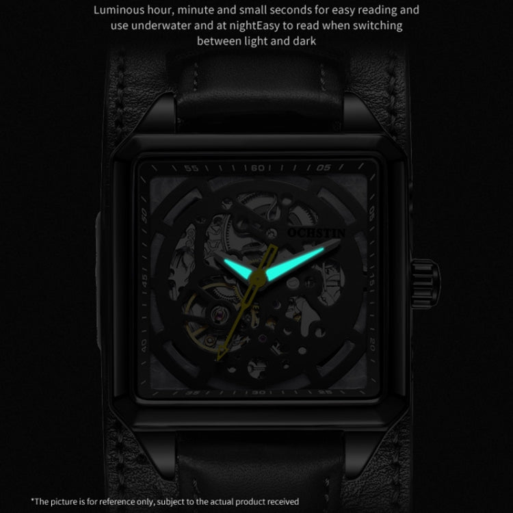 Black skeleton mechanical watch with glowing green-blue hands and dark dial