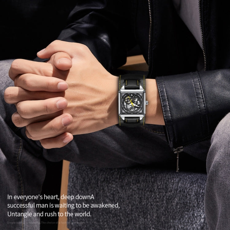 Black skeleton mechanical watch worn on wrist with leather strap and visible movement