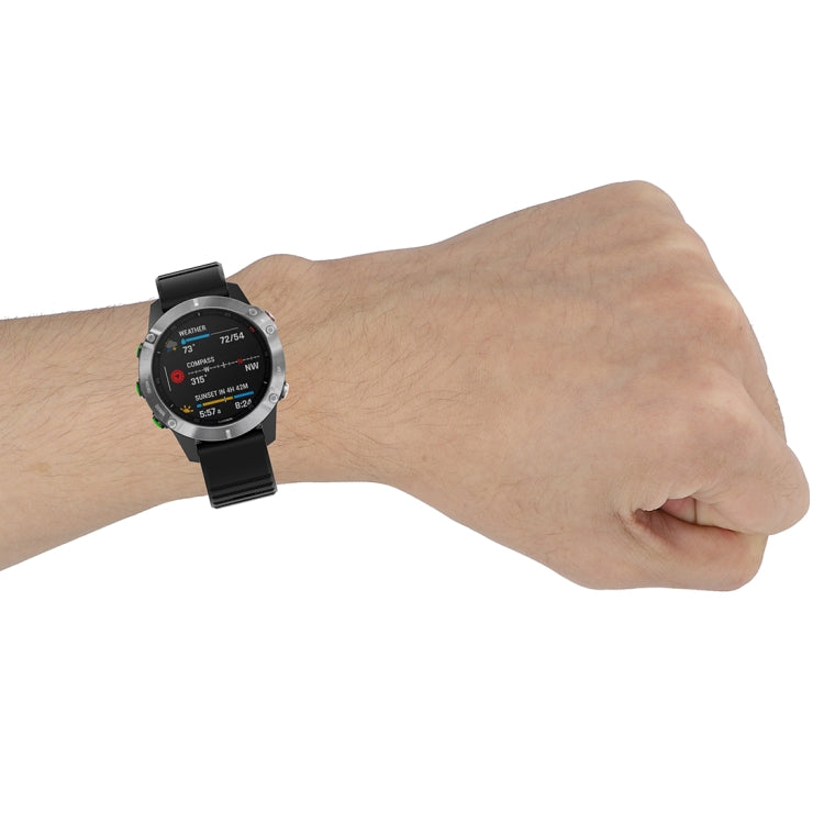 Black 22mm textured wrist strap with plastic buckle on Garmin watch