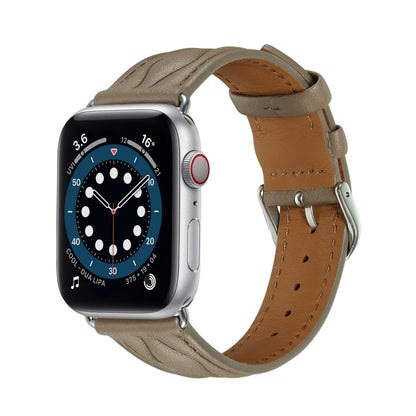 Leather Apple Watch strap in taupe with brown buckle and stitch detail.
