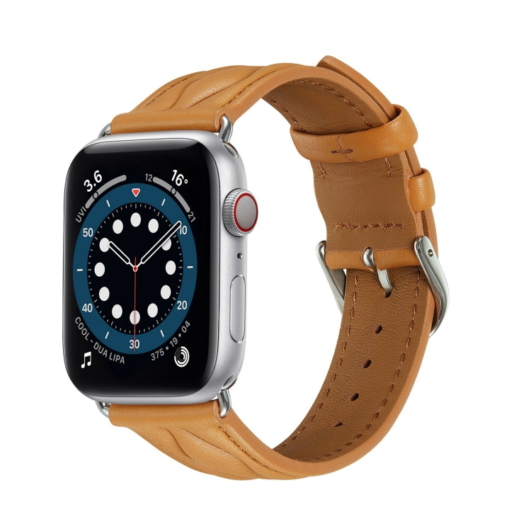 Tan leather Apple Watch strap with stitched texture and metal buckle clasp.