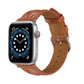 Rust brown leather Apple Watch strap with stitched texture and metal buckle.