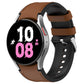 Silicone watch band with metal buckle, tan-brown strap and black watch side.