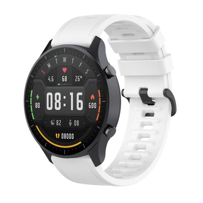 White silicone watch strap with quick release clasp, paired with black smartwatch face