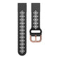 Black silicone watch band with white flower cutouts and rose-gold clasp