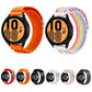 Orange and rainbow nylon watch bands with black smartwatch cases.