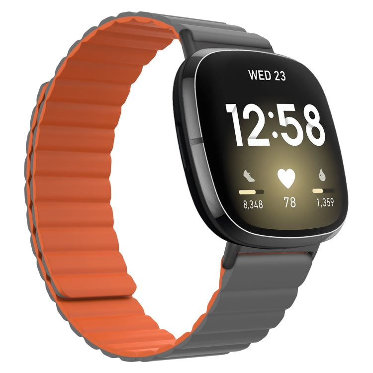 Silicone magnetic watch band, orange with gray clasp, for smartwatch with black display