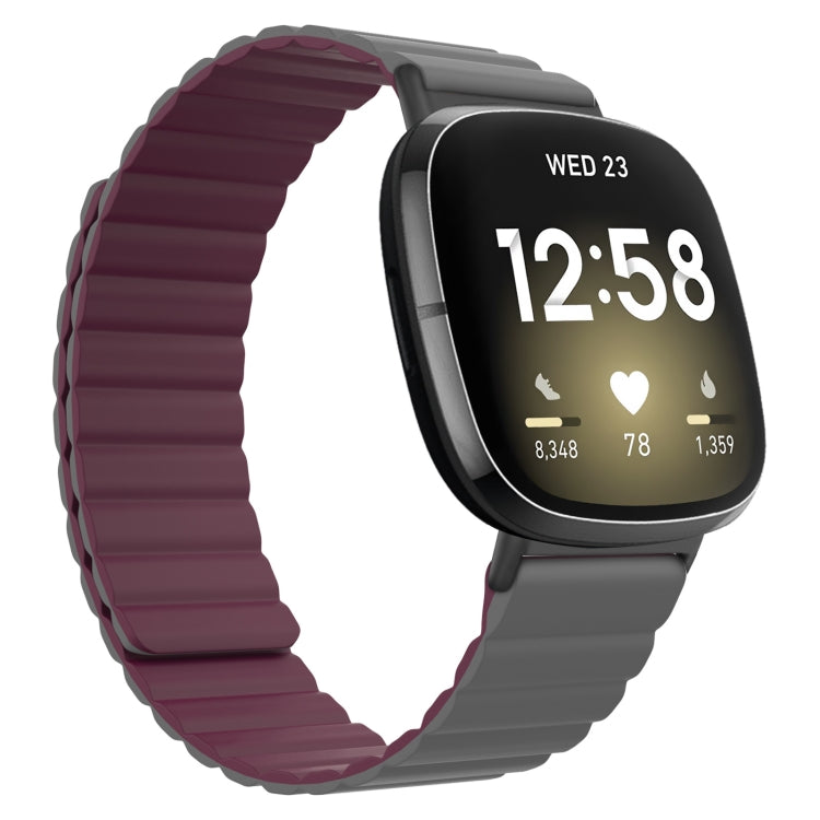 Silicone magnetic watch band, wine red with gray clasp, on a smartwatch with black display