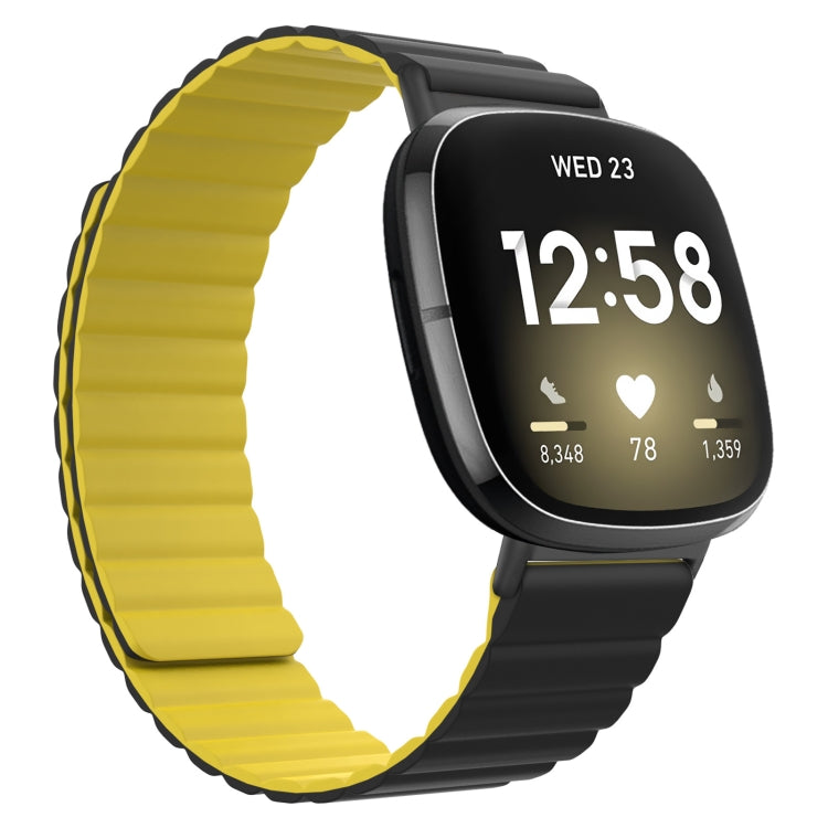 Yellow silicone magnetic watch band with ridged strap and black clasp end.