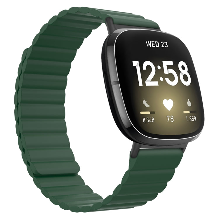 Green silicone magnetic watch band with gray clasp, smartwatch shown with black screen