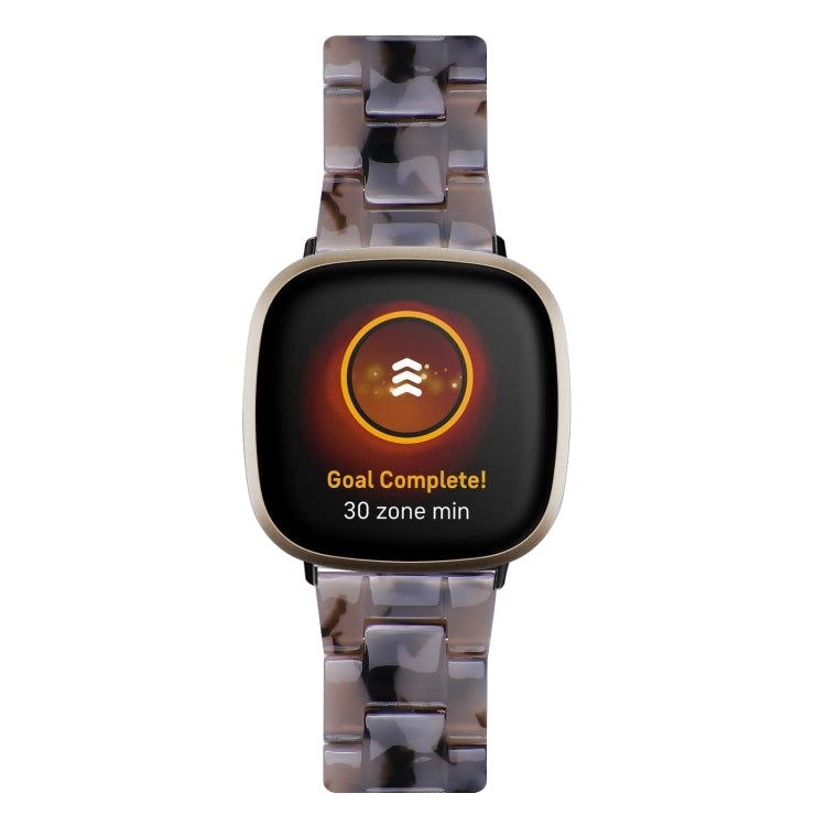 Clear smoky resin watch band with rose-gold case and smartwatch screen