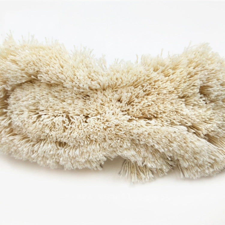 Beige cotton tassel lace trim ribbon with thick, fluffy tassel texture
