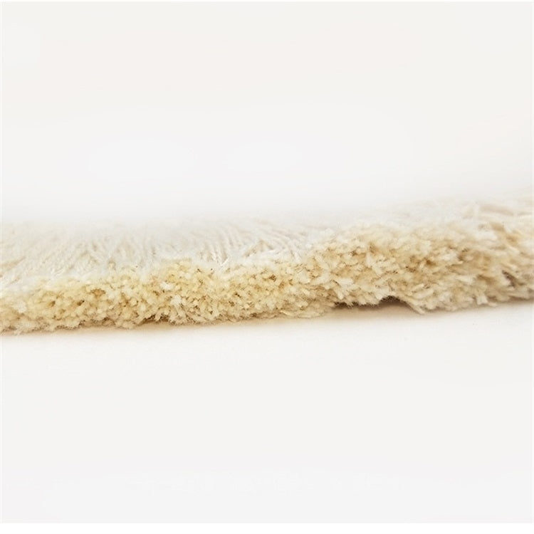 Beige cotton tassel lace trim ribbon showing smooth braided backing edge