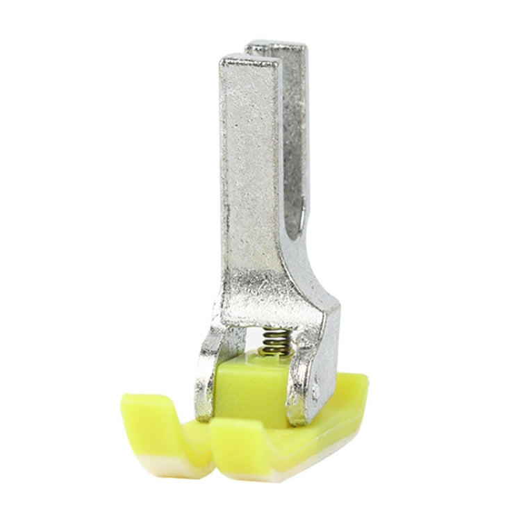 Metal and yellow sewing machine presser foot with spring and rounded yellow base