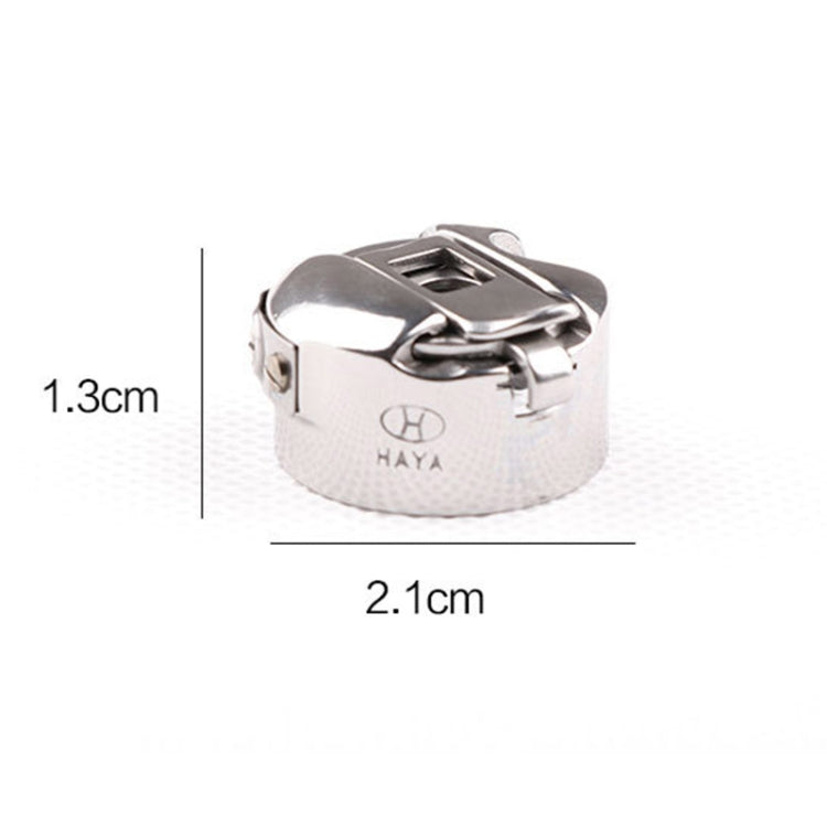 Sewing machine flat bobbin case with latch, HAYA logo; 2.1cm wide, 1.3cm high