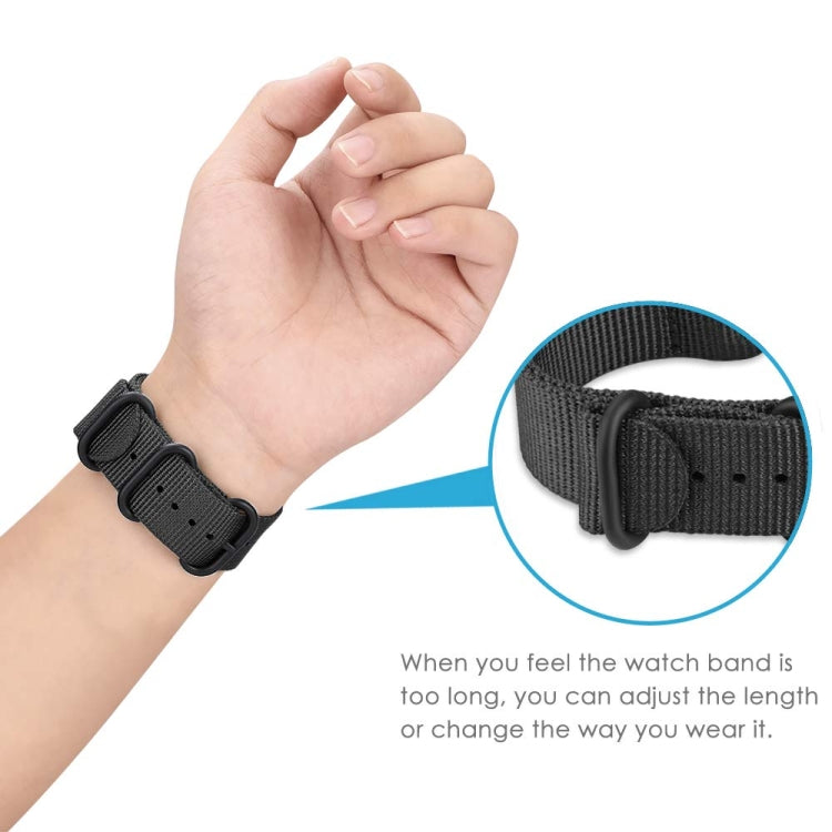 Black nylon watch band on wrist with three-ring steel buckle and adjustment holes