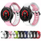 Assorted two-tone silicone watch bands in pink, white, green, black, red, and blue.