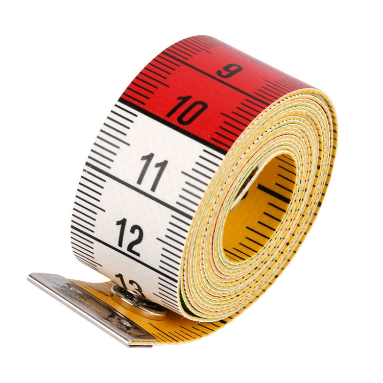 Sewing measuring tape roll with red top scale and white inch numbers, coiled