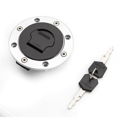 Motorcycle fuel tank cap lock with silver mounting ring and black keyed insert