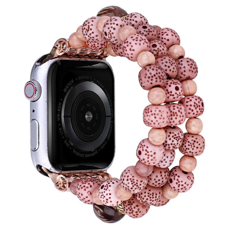 Pink beaded watch band with rose-gold clasp and chunky speckled beads
