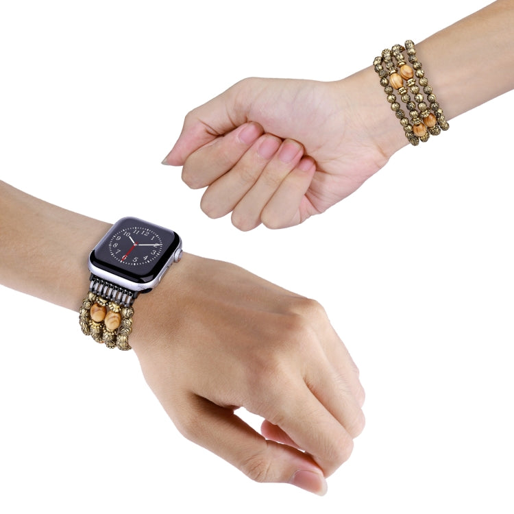 Rose wood bead watch band on wrist with metal clasp and rose-gold beads