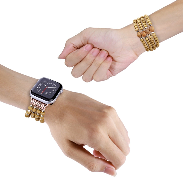 Wood bead watch band with small tan beads and silver spacers, shown on wrist.