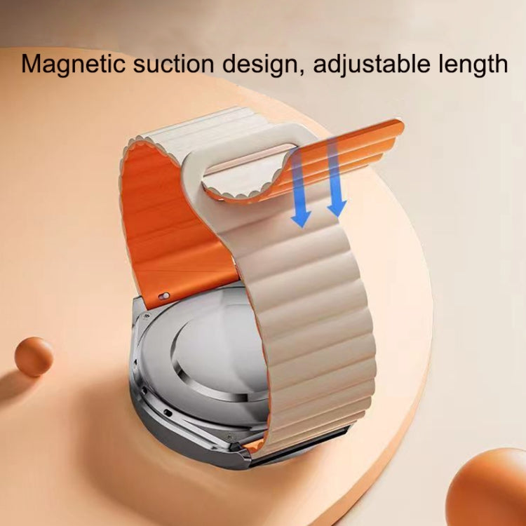 Silicone watch band showing magnetic clasp closure with orange and light strap