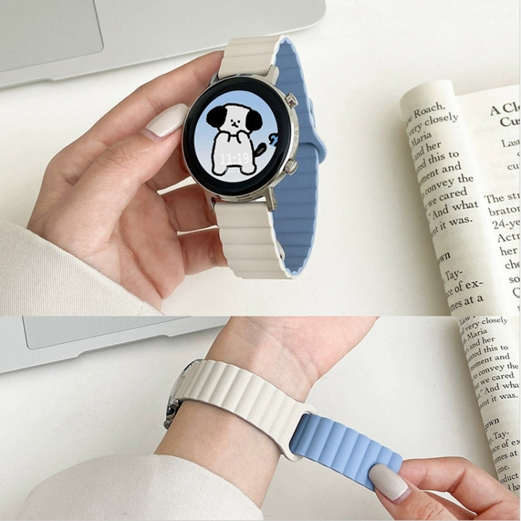 Blue silicone magnetic watch band with clasp, plus matching light-colored band