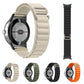 Nylon loop watch bands in starlight, green, black, and orange with connectors