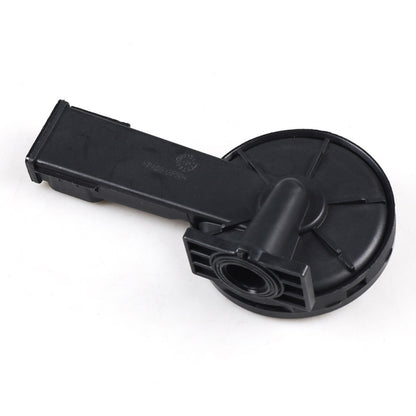 Black plastic camshaft rocker arm housing with circular cover and mounting clip