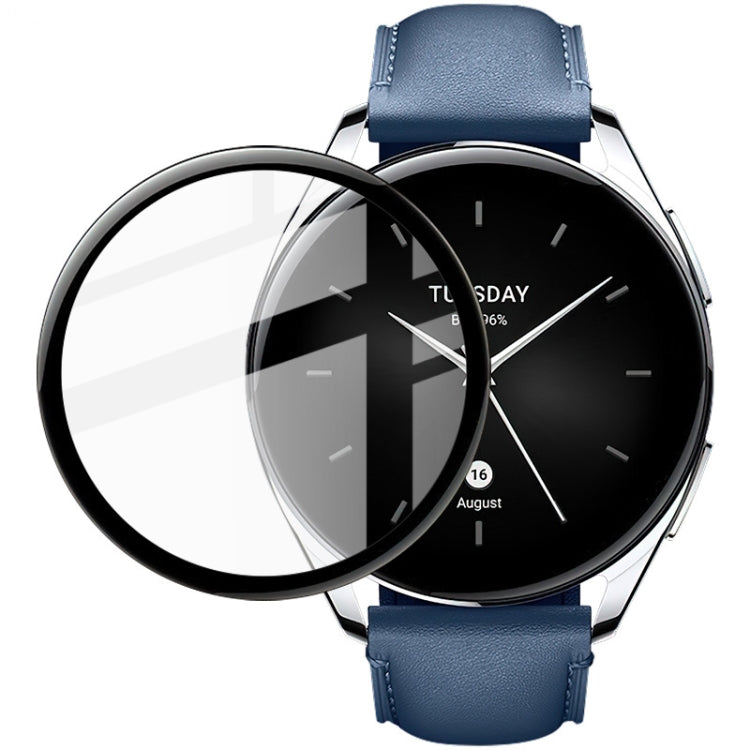 Round clear watch protective film covering smartwatch screen, on blue leather strap watch