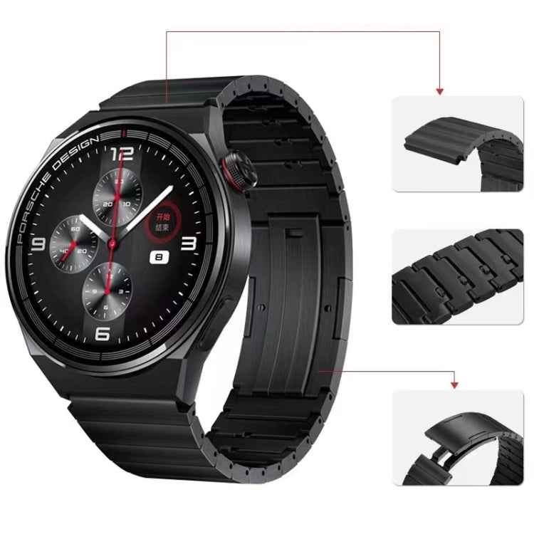 Black quick-release watch band with metal link segments and clasp detail