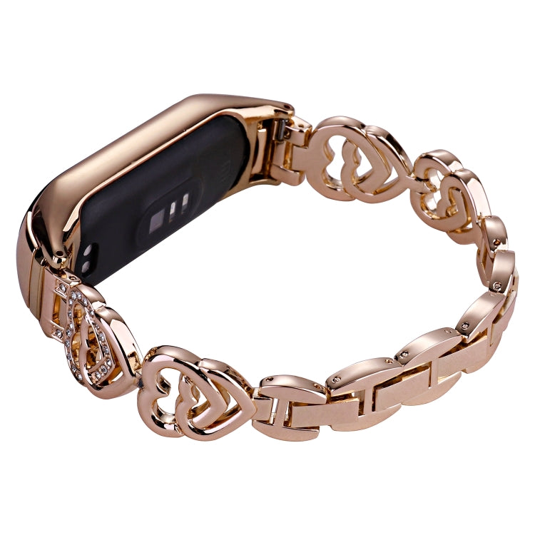 Rose gold diamond metal watch band with sparkling oval diamond centerpiece and clasp