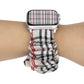 Cloth Apple Watch ring watchband on wrist, black and red plaid fabric