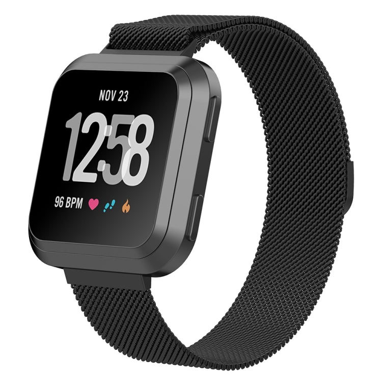 Black Milanese watch strap with metal buckle on a Fitbit Versa smartwatch.