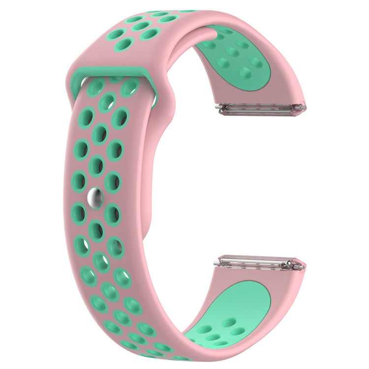 Pink and green two-tone silicone watchband with oval cutout pattern and metal clasp.
