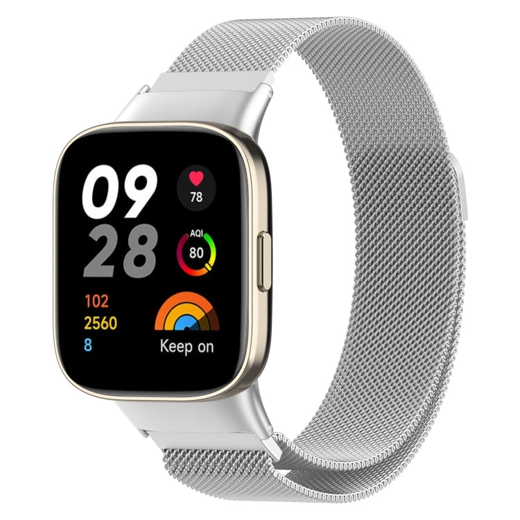 Silver milanese metal watch band on smartwatch, textured mesh links with clasp