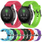 Assorted silicone watch straps in multiple colors shown on watches, with pin tools