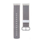 Nylon watch strap with gray woven texture, white keeper band and metal buckle loop