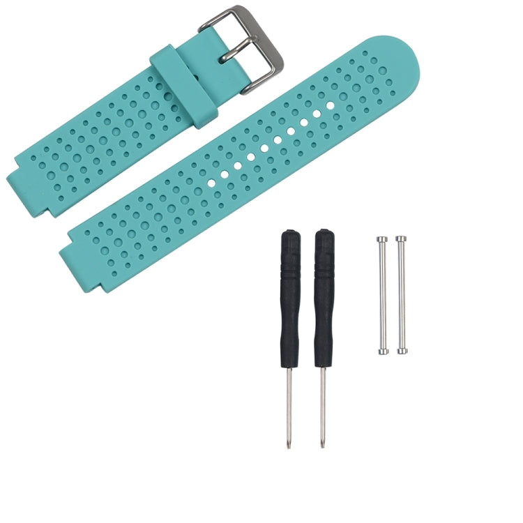 Teal perforated silicone watch strap with metal buckle and adjustment holes, plus pins