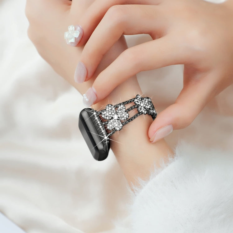 3-leaf clover diamond watch band close-up, black links with silver rhinestone clover charms