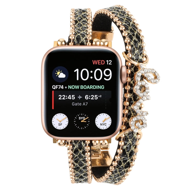 Leather chain watch band with black leather strap and gold links, rhinestone strap centerpiece