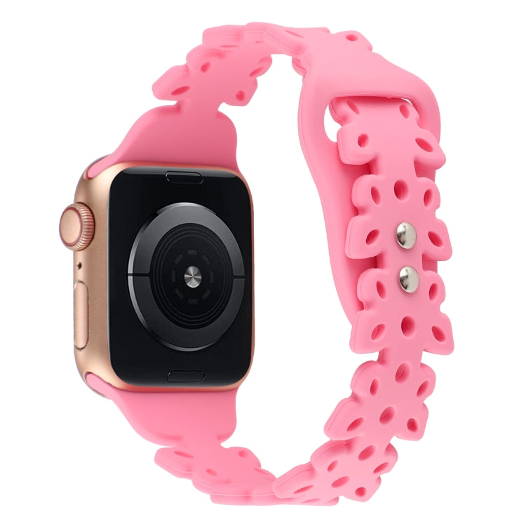 Pink butterfly hollow silicone watch band on Apple Watch, showing butterfly cutouts.