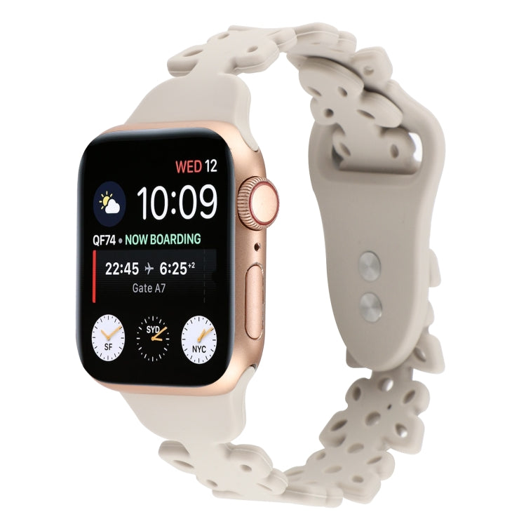 Silicone watch band with butterfly cutouts, white, angled view for Apple Watch