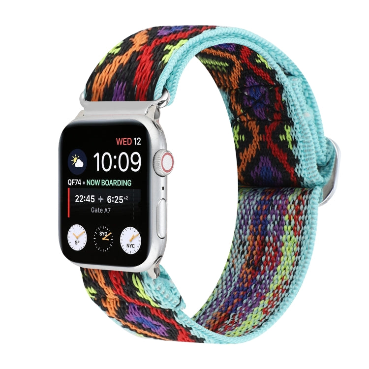 Elastic nylon watch band for Apple Watch, black strap with multicolor abstract woven pattern.