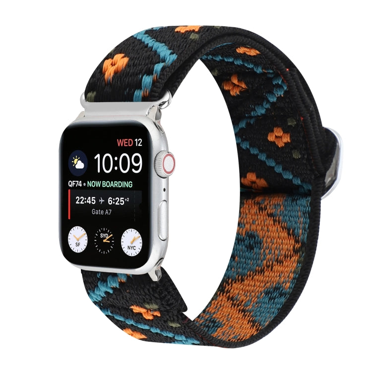 Elastic nylon watch band with geometric pattern in black, blue, and orange; metal buckle.