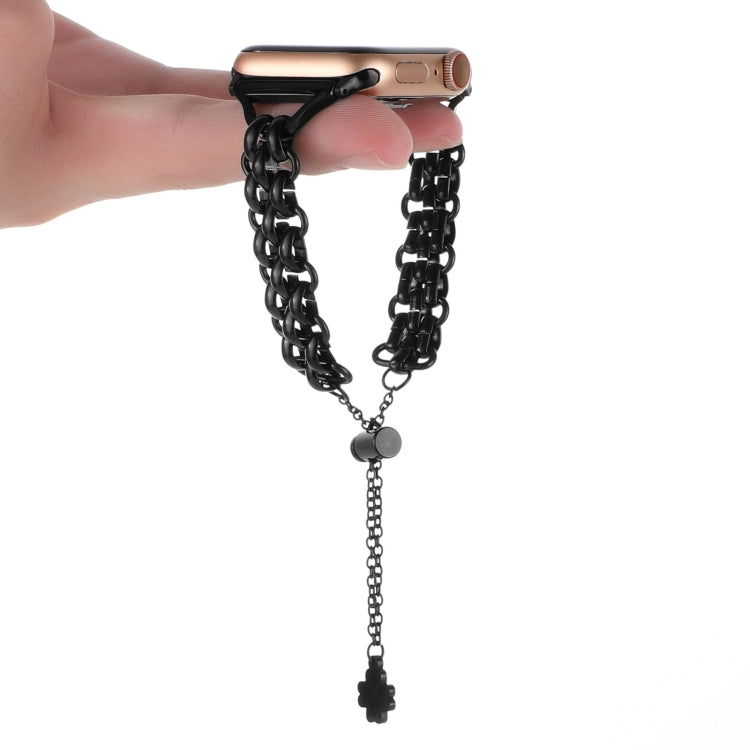 Dual-row chain metal watch band, black, worn on hand with dangling clover charm tassel