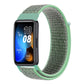 Woven nylon loop watch band with dark green woven strap and mint green end tabs